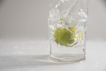 glass of water with ice and lemon