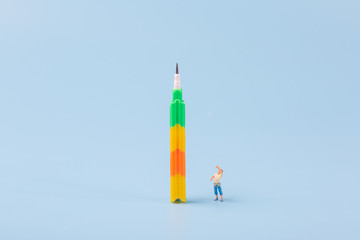 Pencil and man on blue background