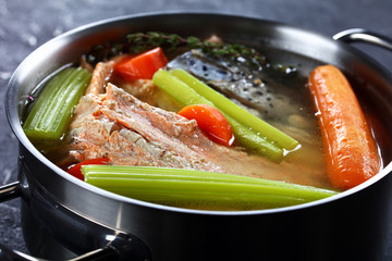 slow-cooked fish broth or soup of salmon