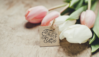 tulips on wooden background/thank you card
