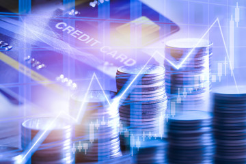 Stock market or trading graph for financial.Double exposure of stack of coins and credit card for financial investment concept.