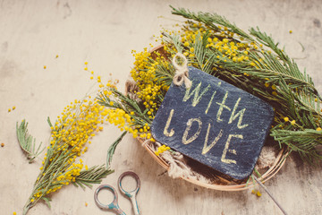 yellow  mimosa flowers on a wooden background