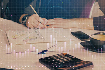 Double exposure of man doing analysis of stock market with forex graph.