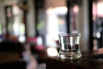 Glass of water on wood table background