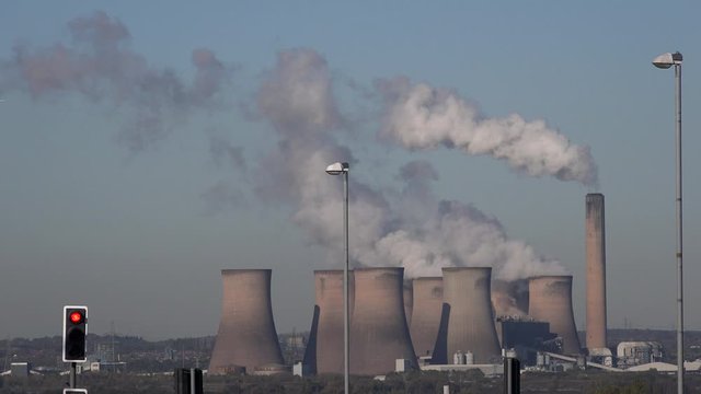 Industrial landscape in the north of England with chimneys and turbines UK 4K