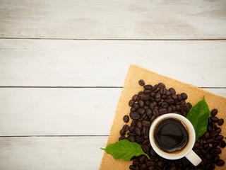 Coffee beans and coffee cup.