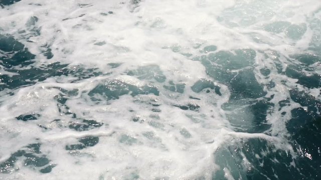 Slowmo Close Up White Foam Waves in Ocean Seen From Moving Boat