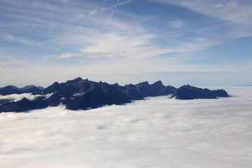Swiss and french alps with a sea of clouds
