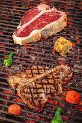 delicious grilled meat with vegetables over the coals on a barbecue