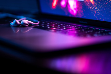 colorful close-up of handsfree on a laptop keyboard with super shallow depth of field