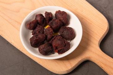 Homemade plum snacks on a small white plate