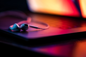 colorful close-up of handsfree on a laptop keyboard with super shallow depth of field