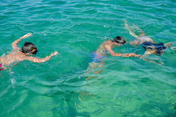 Little boys enjoying swimming underwater in sea