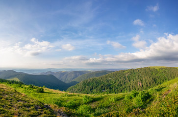 Green mountains in sunny day; natural landscape 