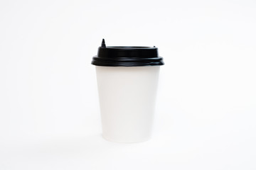 Coffee in a cardboard cup on a white background isolation. Top view, flat lay