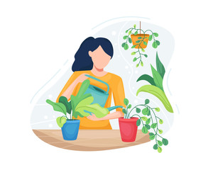 Young woman taking care plants