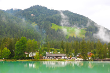 Fototapeta premium Lago di Dobbiaco, Italy. Beautiful view of Lago di Dobbiaco - lake in italian mountains.