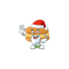 Chocolate macarons cartoon character of Santa showing ok finger