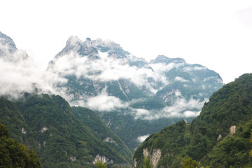 Naklejka premium Cloudy day in italian mountains. Mountain landscape in Belluno province.