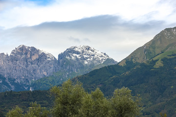 Fototapeta na wymiar Cloudy day in italian mountains. Mountain landscape in Belluno province.