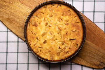 homemade cake in pan on wooden Board. 