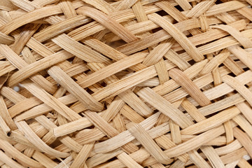 Closeup texture of wicker basket in beige color. Natural materials in the industry. No waste. Recycling. Background and texture. - obrazy, fototapety, plakaty