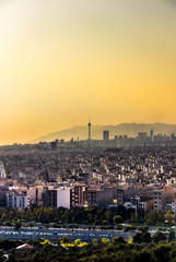 Beautiful sunset over Tehran skyline with Milad tower in the Frame and amazing colorful sky.