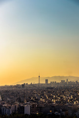 Obraz premium Beautiful sunset over Tehran skyline with Milad tower in the Frame and amazing colorful sky.