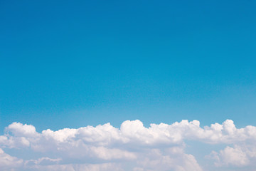 White clouds patterns on bright blue sky , summer background with copy space