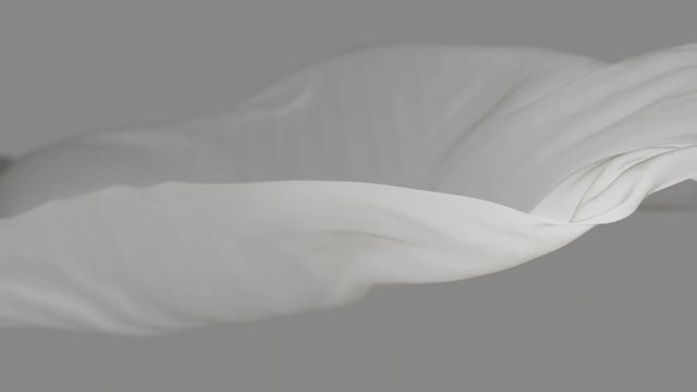 4k White wave satin fabric loop background.Wavy silk cloth fluttering in the wind.tenderness and airiness.3D digital animation of seamless flag waving ribbon streamer riband.