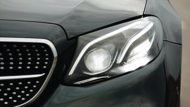 black modern car closeup. concept of fast sport car. car headlights