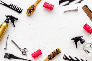 Hairdressing mockup - with brush, spray and sciccors - on white background top-down frame copy space
