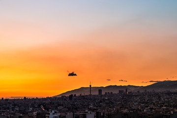 Fototapeta na wymiar Beautiful sunset over Tehran skyline with Milad tower in the Frame and amazing colorful sky.