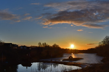 colorful sunrise over the lake. Spring. Russia