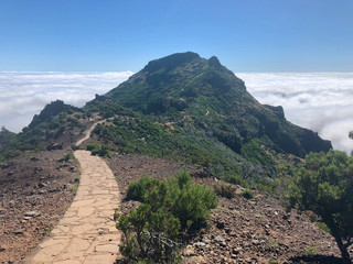 Hiking trail Madeira mountain landscape spectacular view horizon blue sky sea of clouds outdoor traveling concept