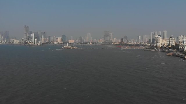 Slider drone shot of the metropolitan Mumbai coastline