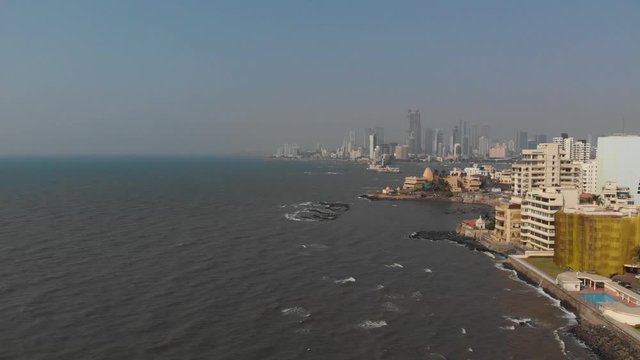 Drone shot over the sea of Mumbai's Haji Ali dargah from the south