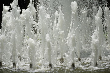 Splash of water gush of water of a fountain abstract background