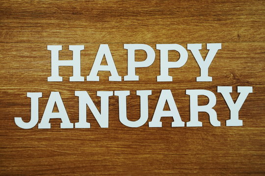 Happy January alphabet letter with space copy on woden  background
