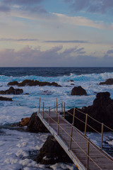 Lava stones on the beach of Piscinas Naturais Biscoitos. Atlantic Ocean. Terceira Azores, Portugal.
