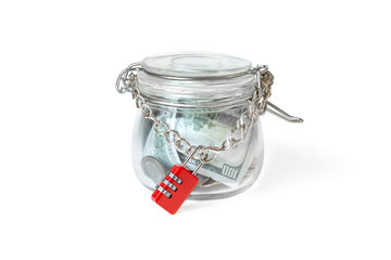 US dollar bills in the glass jar, locked by Chain and Master key. Money in a pot. Home banking...