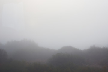 Autumn weather. Dense Fog in the field