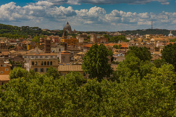 Summer cityscape of the historic center of Rome with a view of roofs and churches