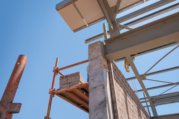 detail view of steel i-beam connecting to concrete wall