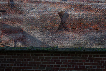 Horebeke Belgium East Flandres. Cramp iron on stone wall. Geuzenhoek