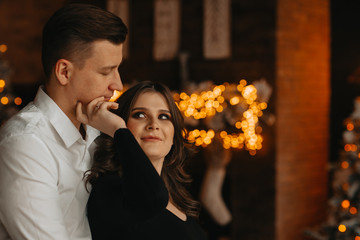 husband from the back gently hugs his pregnant wife