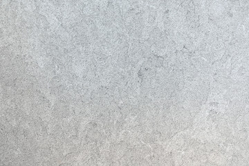 Obraz premium Marmoriertes Muster einer glatten hellgrauen Steinplatte in Nahaufnahme