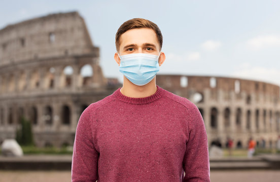 Health, Safety And Pandemic Concept - Man Wearing Protective Medical Mask For Protection From Virus Disease Over Coliseum In Rome, Italy Background