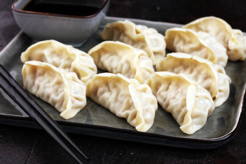 Gyoza or dumplings snack with soy sauce.