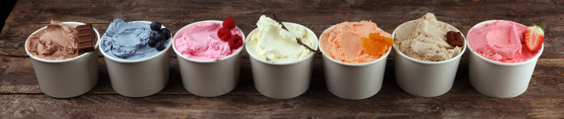 Various of ice cream flavor with fresh blueberry, strawberry, almond, chocolate, vanilla setup on rustic background . Summer and Sweet cold ice cream